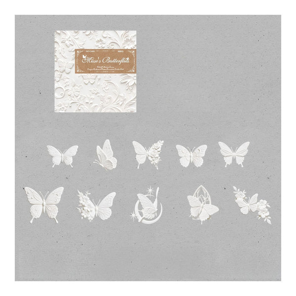 A sheet of white butterfly and floral die-cut stickers displayed on a textured gray background, with the brand label 'Mia's Butterflies' visible in the upper left.
