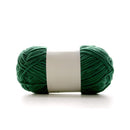 Green skein of yarn with a white label on a white background