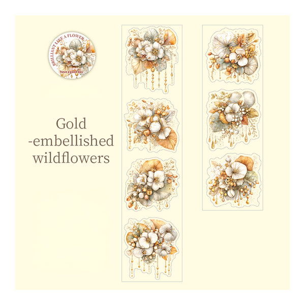 A sheet of floral temporary tattoos or decals featuring gold-embellished wildflowers. The design includes a circular logo at the top left reading 'Wildflower Time Flowers' and the text 'Gold -embellished wildflowers' on the left side.