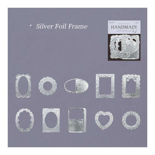 A set of silver foil embossed frames in various shapes including ovals, rectangles, hearts, and circles, displayed on a lavender background with a small product packaging insert in the upper right.