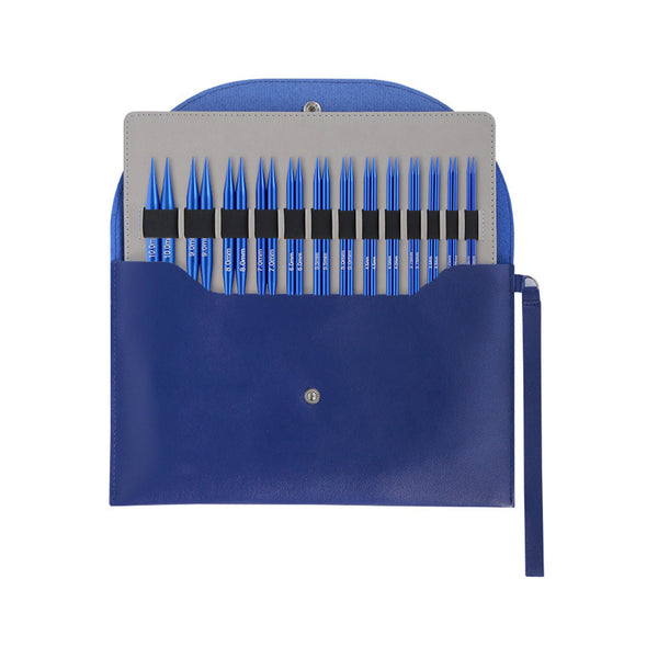 A blue leather knitting needle holder pouch containing a set of blue knitting needles, shown against a plain white background.