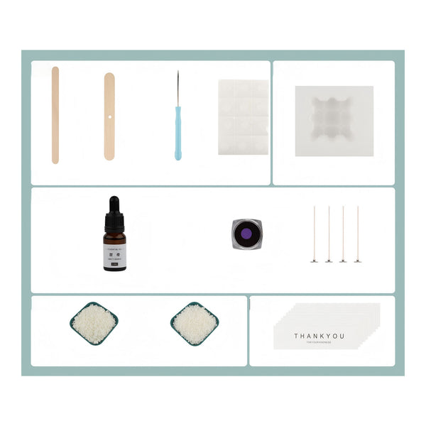 A flat-lay collage of craft or DIY kit components on a white background with a light blue border. Items include wooden sticks, a blue-handled tool, a square white sheet, a translucent square piece, a small amber dropper bottle, a round purple-tinted square, four thin metal rods, two powder samples, and a card reading THANKYOU.