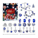 A Christmas-themed jewelry set displayed on a white background, featuring a colorful Christmas-themed gift box, multiple silver charm bracelets, several blue and silver beads, and several silver pendants with blue accents. The box has a festive holiday illustration with the text 'Merry Christmas'.
