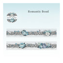 A decorative lace trim sample labeled 'Romantic Bond' with floral and ribbon detailing in pale blue, white, and gray on a light blue gradient background. A circular logo reading 'Grigoriy's handmade' appears at upper left.