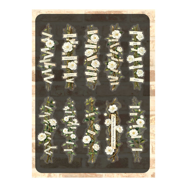 A sheet of decorative stickers featuring vintage-style floral arrangements with white roses, green leaves, and small cream banners with text, arranged in two rows on a dark background with a distressed beige border.