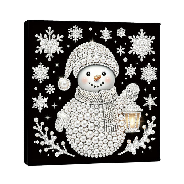 A square black canvas wall art print featuring a stylized snowman made of white pearls and beads, surrounded by white snowflakes and branches, with a glowing lantern in one hand.