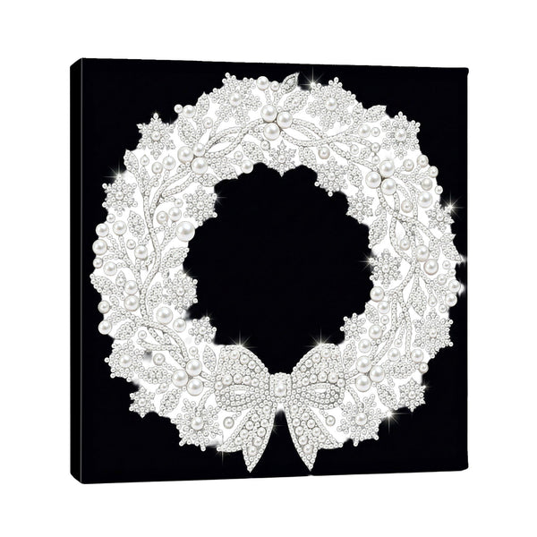 A square black canvas wall art print featuring an intricate white filigree wreath with a bow, photographed against a plain white background.