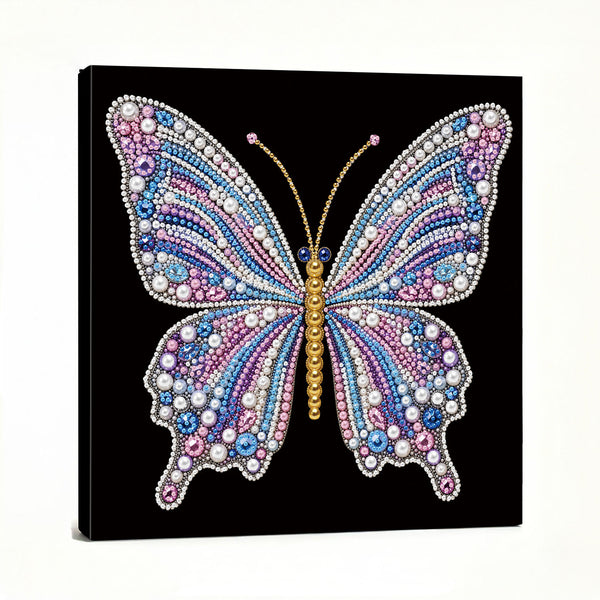 A square canvas wall art print featuring a large butterfly made of colorful rhinestones and beads on a black background, shown at a slight angle against a white studio backdrop.
