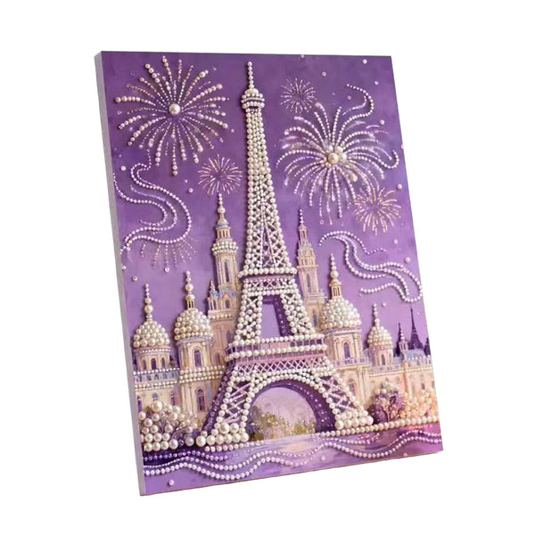 A rectangular canvas print featuring a Paris-themed design with the Eiffel Tower, domed buildings, fireworks, and pearl-like bead details on a purple background.