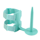 A mint green plastic and fabric adjustable support brace with a circular suction-style base and a long pointed stand, shown on a plain white background.