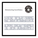 A product display card for 'Shimmering Snowflakes' washi tape. The card features a black border, the product name in black text, a circular logo for 'Agile Silver Color' in the top right, and two horizontal strips of the silver and white snowflake patterned tape in the center.