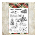 A sheet of clear stamps with black-and-white Christmas-themed illustrations and text, including trees, snowflakes, a pinecone, a bird, and holiday phrases. The sheet is photographed on a textured beige background with a subtle vintage pattern.