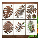 Six square decorative tiles arranged in a 2x3 grid, each featuring a different tropical leaf design in dark brown wood cutout over an off-white tile background. The leaves include monstera, palm, and fern motifs.