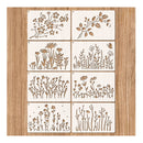 Eight square wooden stencils with laser-cut floral and botanical designs, arranged in a 2x4 grid on a light wood background.