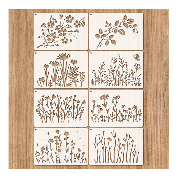 Eight square wooden stencils with laser-cut floral and botanical designs, arranged in a 2x4 grid on a light wood background.