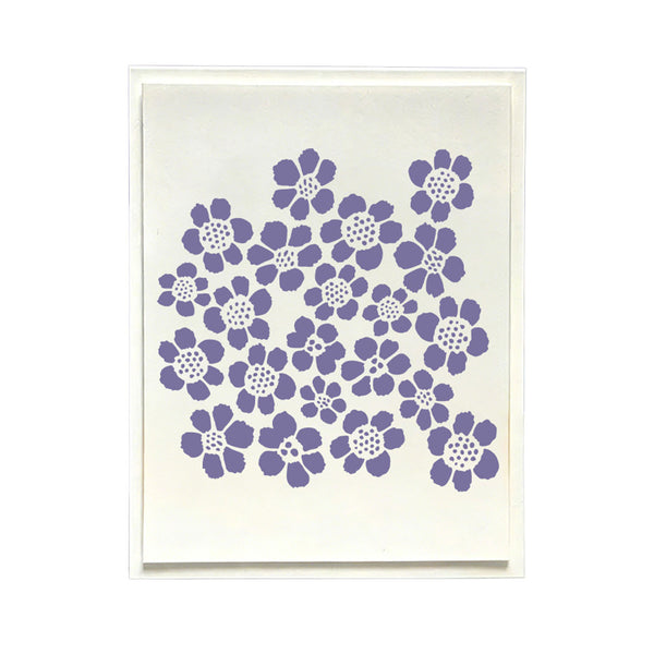 A square art print or card featuring a cluster of purple hand-drawn style flowers on a warm off-white background, presented in a thin white frame against a clean white backdrop.