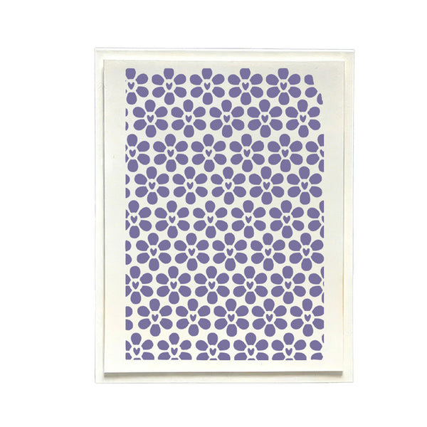 A framed art print featuring a repeating pattern of purple stylized flowers on a white background, enclosed in a thin white frame.