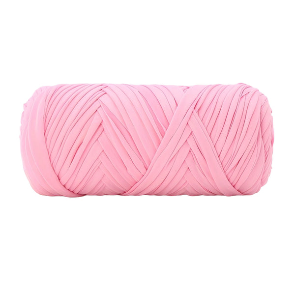 A single ball of light pink craft yarn with a textured, ribbed surface, isolated on a solid white background.