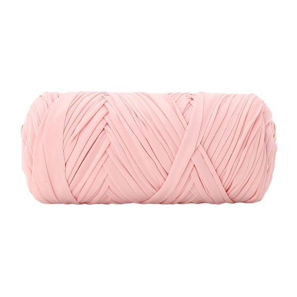 A single ball of light pink chunky yarn, photographed against a solid white background.