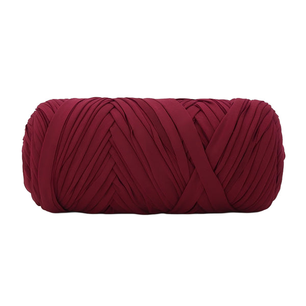 A single ball of chunky yarn in a deep burgundy red color, photographed against a solid white background.