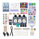 UV resin kit with LED light, resins, molds, and tools on a white background