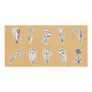A sheet of temporary tattoos featuring hand-drawn black and white botanical illustrations of tulips and flowers, presented on a tan rectangular backing against a white background.