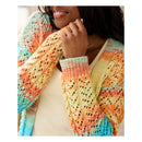 A close-up of a person wearing a colorful, open-front knit cardigan with a textured crochet pattern. The cardigan features pastel stripes of orange, yellow, pink, and turquoise blue.