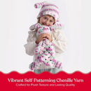 A child wearing a pink, white, and mint green crocheted hat, matching mittens, and a chunky chenille scarf, holding a plush bunny toy. A red banner at the bottom reads 'Vibrant Self-Patterning Chenille Yarn' with white text.