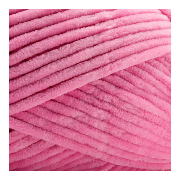Close-up of pink yarn on a white background