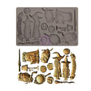 A wizard-themed metal casting or craft mold set shown on a white background, with a gray rectangular mold plate at the top and multiple corresponding metallic miniature designs below in gold and bronze tones.