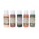 Five bottles of Color Chronicles water acrylic paint by Mel Coe, featuring peach, mauve, forest green, terracotta, and moss green colors, arranged in a row against a white background.