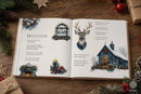 An open children's book spread laid on a rustic wooden surface, surrounded by holiday decorations including pinecones, evergreen branches, ornaments, and wrapped gift boxes. The pages show Christmas-themed illustrations and nursery-style text, with a window, deer head, snowy church, and small holiday scene printed on the spread.