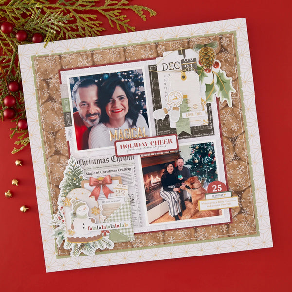 A square scrapbook layout or photo collage board styled with Christmas-themed paper cutouts, photos of a couple, decorative tags, pinecones, holly, and newspaper-style elements, placed on a red background with holiday greenery and red berries around it.