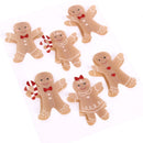 Six gingerbread person stickers or decals arranged on a white background, featuring light brown bodies with white icing-style outlines and small red accents like bows, hearts, and candy details.