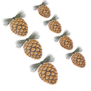 Six decorative pinecones with textured brown scales and green pine needles, arranged diagonally on a plain white background.