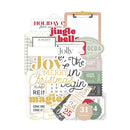 A collection of Christmas-themed scrapbooking paper sheets and embellishments arranged on a white background, featuring festive text like 'Jingle bells', 'Joy to the Christmas person', and holiday dates in red, green, beige, and black.