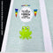 Green frog on a polka dot background with rainbow elements and text