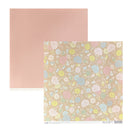 Two square sheets of scrapbook paper. The top-left sheet is a solid, matte dusty rose pink.