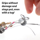 small silver metal spring clamps with attached jump rings, shown on a plain white background.