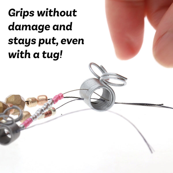 small silver metal spring clamps with attached jump rings, shown on a plain white background.