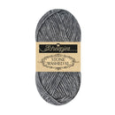 A skein of Schiepjes Stone Washed XL yarn in a heathered gray and black colorway, featuring a beige paper label with black text.