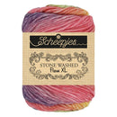 Multicolored skein of yarn with 'Scheepjes' label on a white background