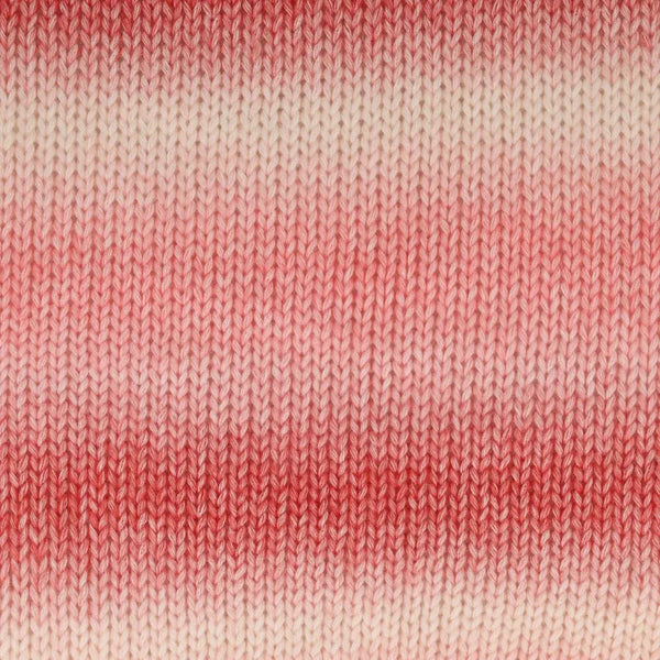 Close-up of a knitted fabric with horizontal stripes fading from coral pink at the top and bottom to a warm off-white in the middle.