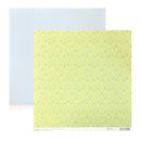 A sheet of Green patterned paper with small scattered confetti dots in white, light blue, pink, and brown, layered over a larger pale blue sheet on a white background.