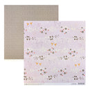 Two square paper sheets from SEI Love Story collection, one in Brown with white flowers pattern and the other in a light purple floral and bird pattern with white glitter, displayed on a white background.