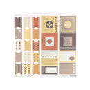 A sheet of Madera Island cardstock tabs, frames & labels featuring various rectangular and square design elements in warm neutral tones of beige, brown, orange, and yellow, displayed on a clean white background.