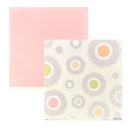Two square sheets of paper on a white background: one solid pastel pink sheet and one cream sheet with a retro concentric circle pattern in pastel pink, gray, yellow, and green.