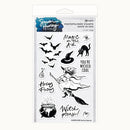 Simon Hurley Creations Halloween photopolymer stamp set in retail packaging, featuring black and white witch-themed stamps including a witch riding a broomstick, a cauldron, bats, a cat, a spider, and phrases like 'Magic in the Air' and 'You're Wicked Cool'.