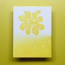 Card with a yellow flower design on a yellow background