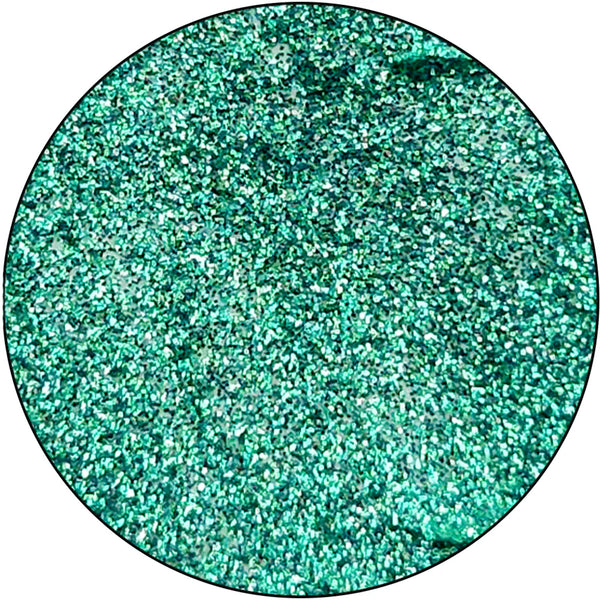 Close-up of teal glitter on a white background